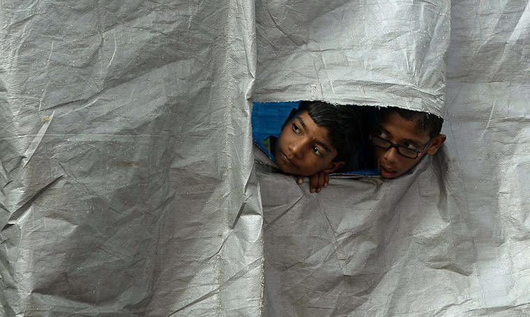 Hindu God Ganesha : Two boys watch a procession