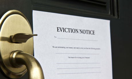 Eviction notice letter posted on front door of house