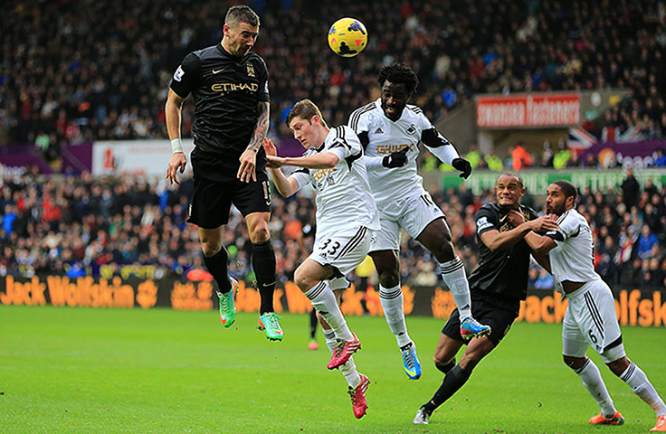 Premier New Years Day : Aleksandar Kolarov battles for the ball in the air