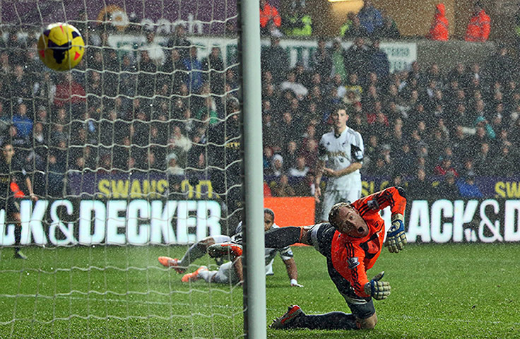 Premier New Years Day : Swansea City's golakeeper can't stop the downpour