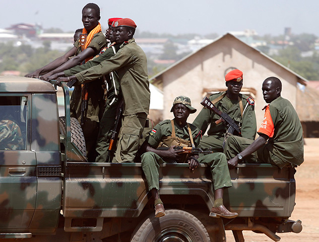 Goran Tomasevic: SPLA soldiers drive in a vehicle in Juba, South Sudan