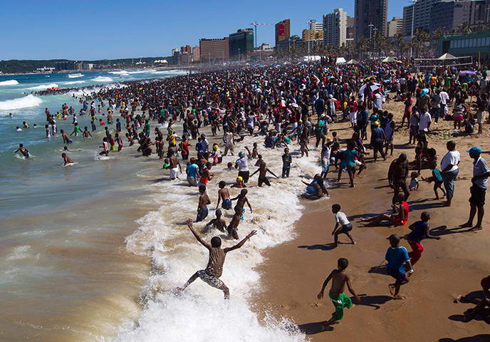 Photo highlights: Crowds of people visit the beach on New Year's Day in Durban, South Africa