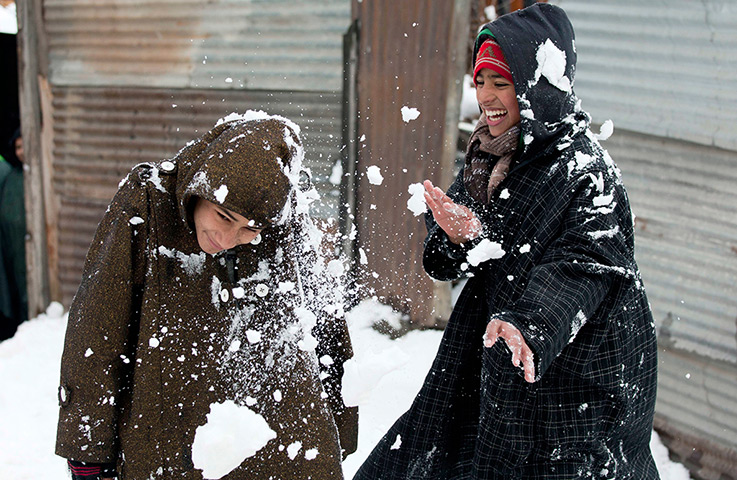 Photo highlights: Children throw snow at each other in Srinagar, India
