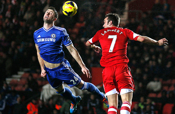 Premier New Years Day : Chelsea's Gary Cahill flies in a challenge