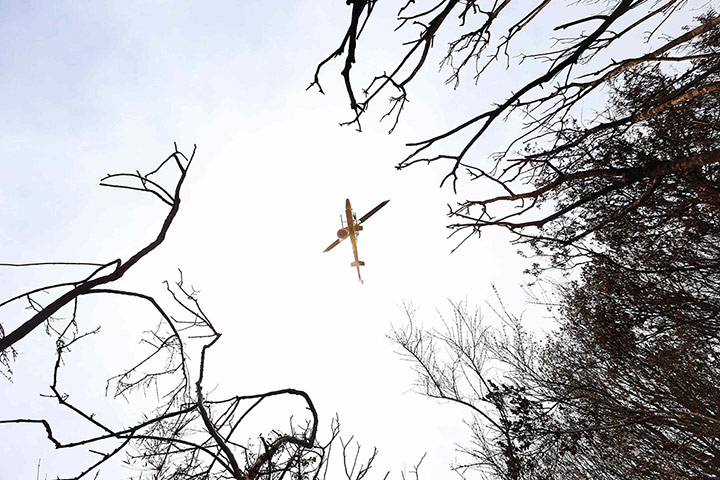 20 Photos: A helicopter assists in fighting a forest fire in Melipilla, Chile