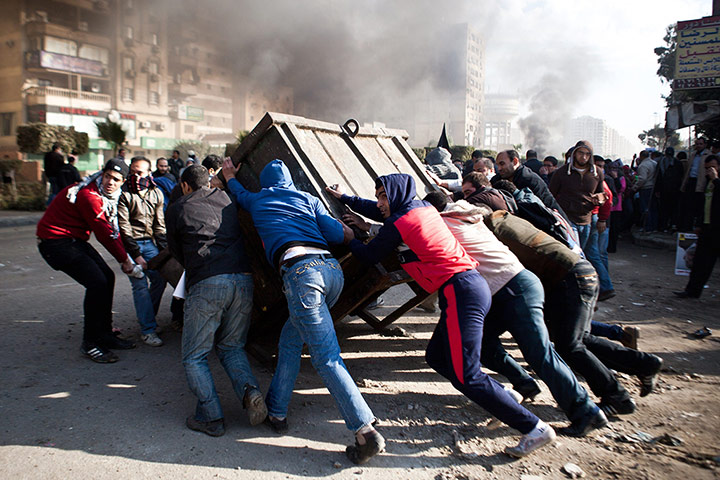 20 Photos: Supporters of ousted president Mohamed Morsi block a street in Cairo
