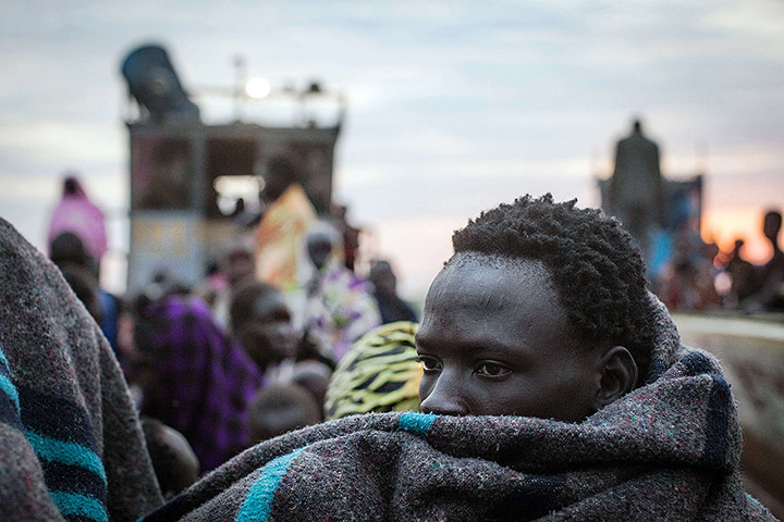 20 Photos: Civilians fleeing violence in the Bor region arrive at a port in Awerial