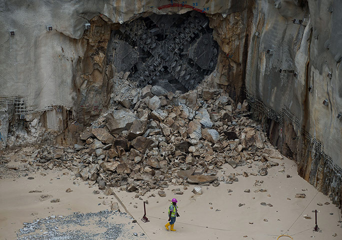 20 Photos: A worker next to a variable density tunnel boring machine in Kuala Lumpur