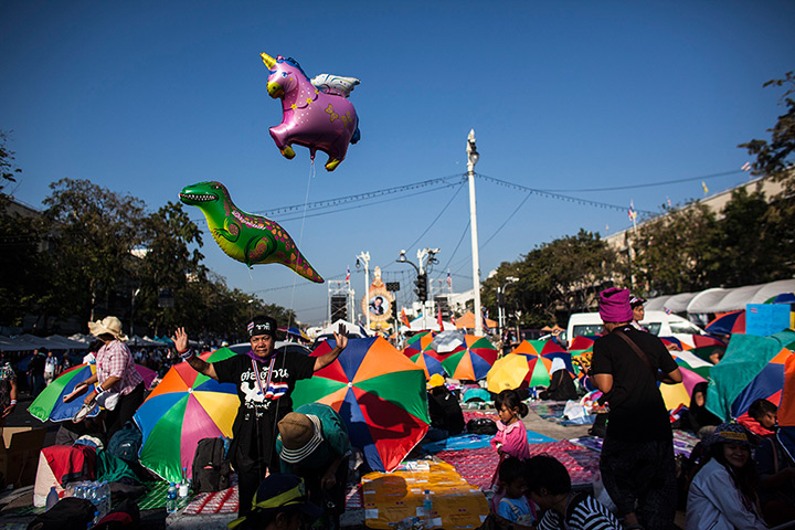Weekend in pictures: Bangkok, Thailand: A woman dances in the anti-government protesters' encamp