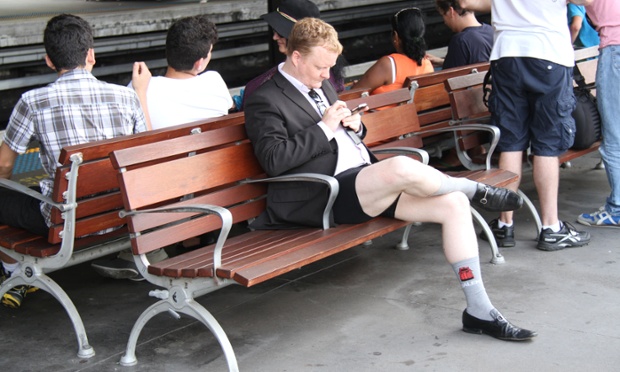 A businessman waits for the train on the platform at Circular Quay train in Sydney.