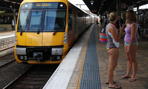 Participants in Sydney's 'No Pants Subway Ride' wait on the platform at Sydneys Central Station.