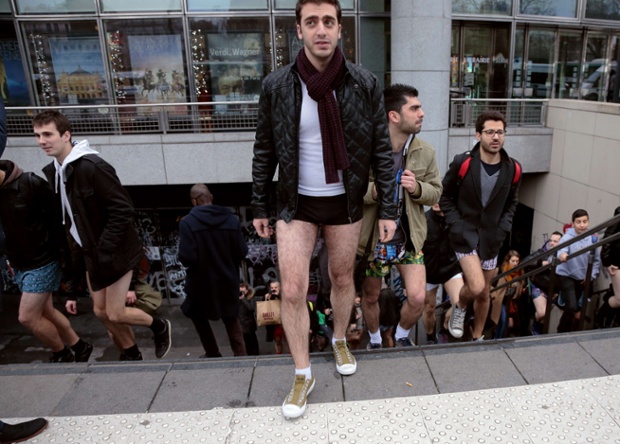 People in underwear leave a subway station in Paris.