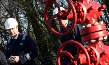 David Cameron is taken on a guided tour of the IGas shale drilling plant oil depot near Gainsborough, Lincolnshire on January 13, 2014.
