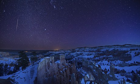 a shooting star in the night sky over the Amphitheatre, Bryce Canyon, Utah, USA