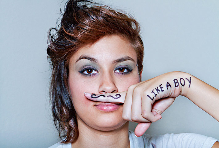 Big Picture - What I Be: young woman with the words 'like a boy' on hand