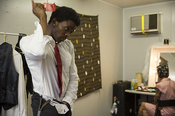 Limbo: Hilton Denis combs his hair