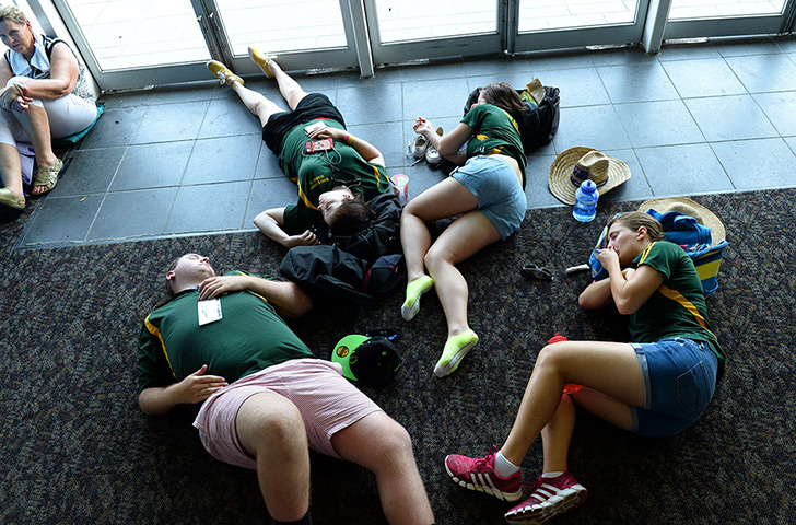 Australian Open heat: Tennis fans rest indoors from the heat after play was suspended due to the 