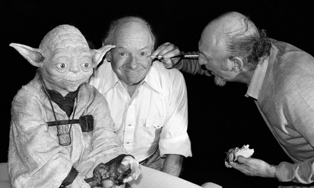 Irvin Kershner, director of the Empire Strikes Back, applies make-up to Stuart Freeborn who created Yoda's look as is known as the grandfather of modern makeup design.