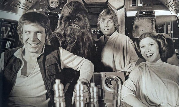 Harrison Ford, Peter Mayhew, as Chewbacca, Mark Hamill and Carrie Fisher share a lighter moment on set.