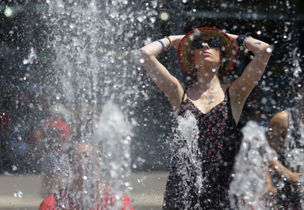 It's really hot in Australia: A tennis fan cools down in the fountain in the scorching heat at the Australian Open tennis championship in Melbourne.