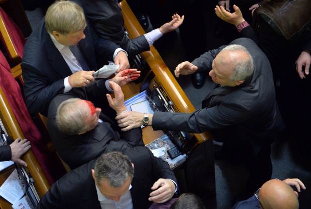 There's been a bit of a fracas in the Ukrainian parliament. A deputy of the pro-Russian majority with blood on his face following an argument with a pro-EU opposition MP during a session to debate the 2014 state budget.