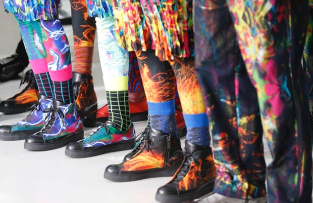 Models present shoes by Japanese designer Yusuke Takahashi for Issey Miyake's men's fall-winter 2014-2015 fashion collection on show in Paris.