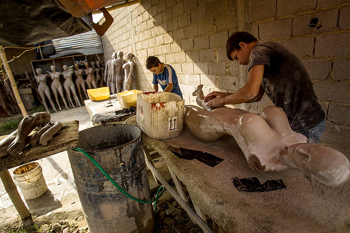 Well endowed mannequins: Workers construct mannequins at Eliezer Alvarez's workshop in Valencia