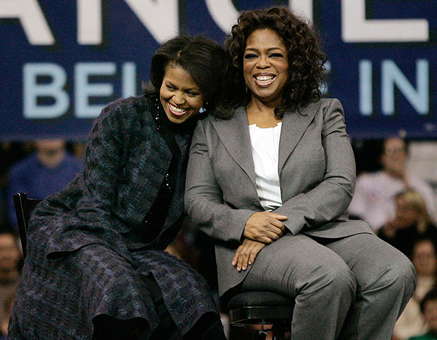 Michelle Obama at 50: December 9, 2007: Michelle Obama and Oprah Winfrey sit together during a ra