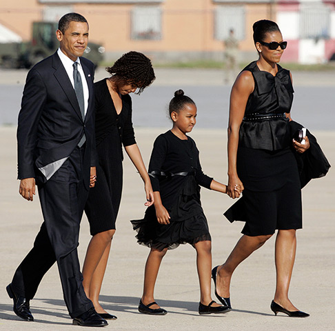 Michelle Obama at 50: July 10, 2009: President Barack Obama and family arrive at an airport, near