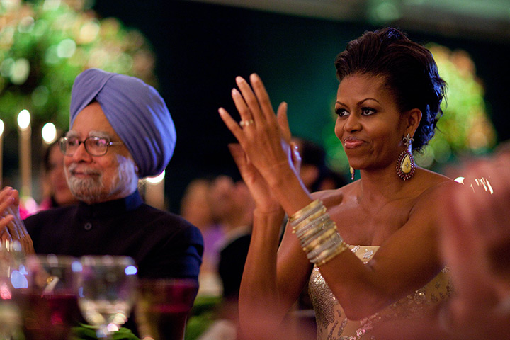 Michelle Obama at 50: November 24, 2009: First lady Michelle Obama claps during the State Dinner 