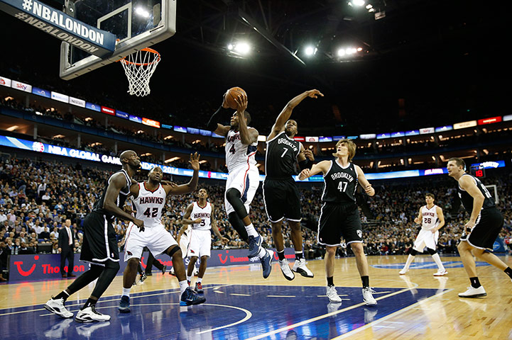 nba at the o2: Atlanta's Paul Millsap drives to the basket 