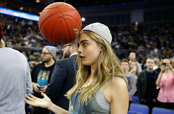 nba at the o2: Model Cara Delevingne goofs around at half time