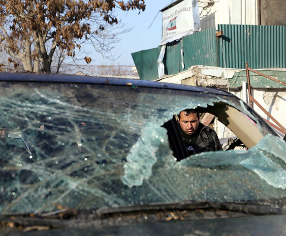 Kabul attack:  security official inspects the site