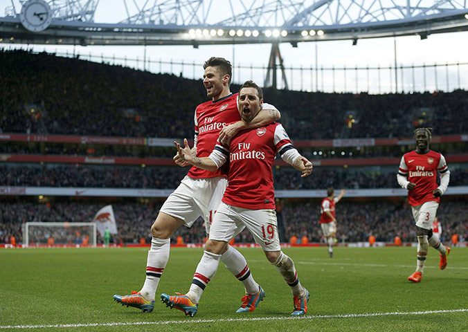 saturday roundup: Arsenal's Spanish midfielder Santi Cazorla celebrates