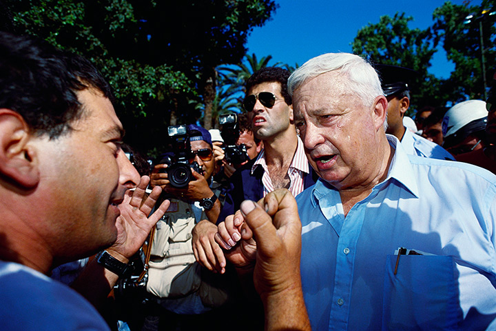Ariel Sharon in pictures: 1990: Sharon as he speaks with angered demonstrators concerning a shortage 