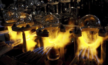 Incandescent bulbs being sealed on a blazing machine