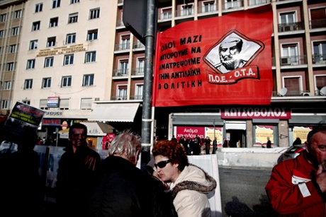 School guards who have been suspended with reduced pay prior to being laid off, protest outside the ministry of Interior Affairs  in central Athens, Greece, 20 January 2014.