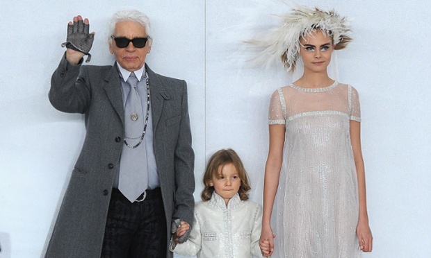 Designer Karl Lagerfeld, his godson Hudson Kroenig and model Cara Delevinge walk the runway during the Chanel show as part of Paris Fashion Week Haute-Couture Spring/Summer 2014 in Paris, France.