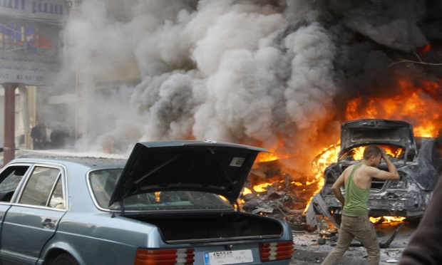Smoke and blaze from burning cars are seen following an explosion in Haret Hreik, a Beirut neighbourhood, Lebanon. Two people were killed in the suicide car bombing.