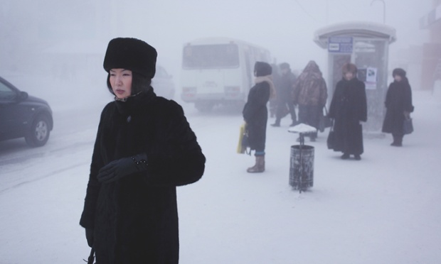 A Yakutian woman in the city centre. Steam from factories, cars and people creates a thick fog in winter which lingers through the coldest weeks. Yakutsk