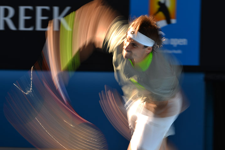 aussie open day 9: Spain's David Ferrer plays a shot