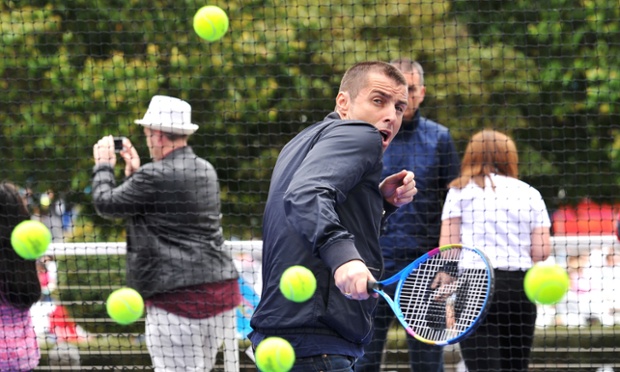 Liam Gallagher looks less at home on the tennis court as he faces the hotshots ball kids during the Australian Open at Melbourne Park.