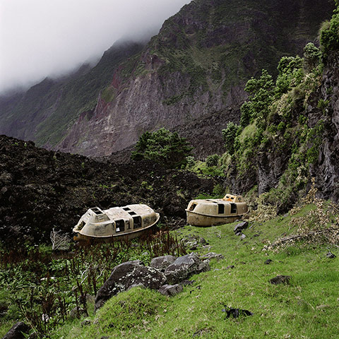 Big Picture - Empire: two abandoned lifeboat shells in green landscape