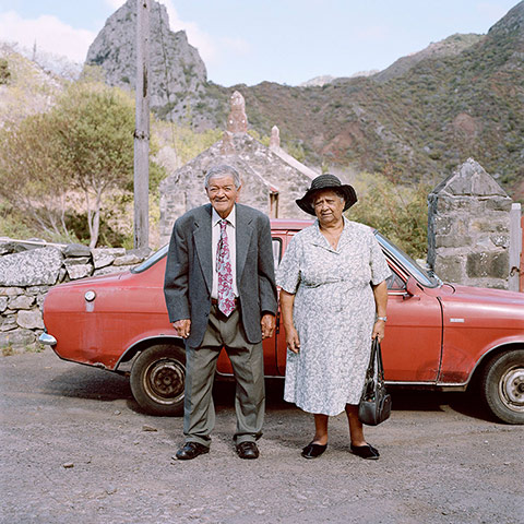 Big Picture - Empire: Elderly couple stand in front of a red car