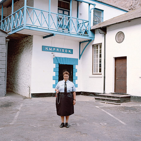 Big Picture - Empire: woman dressed in uniform stands outside prison
