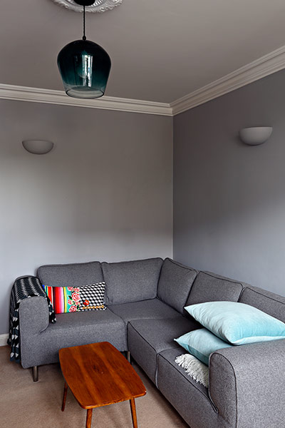 Homes - Petra Tyler: lounge with grey walls and grey sofa