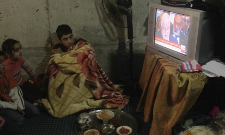 Syrian refugee boy watches Geneva talks