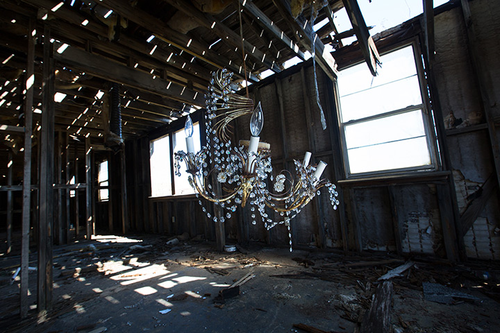 Rebuilding New Orleans: A broken chandelier inside a blighted home