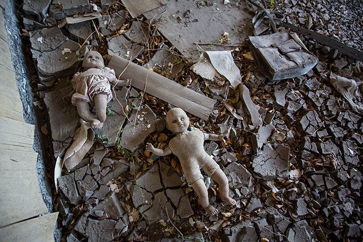 Rebuilding New Orleans: Dolls left in the mud