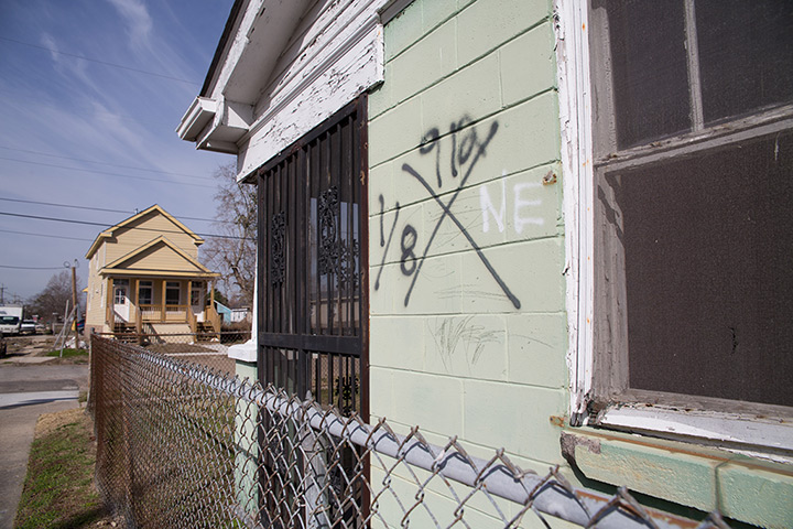 Rebuilding New Orleans: A house in the Lower Ninth ward with an X code, spraypainted by search-and-